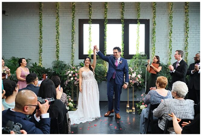 Bride and groom celebrating at wedding ceremony