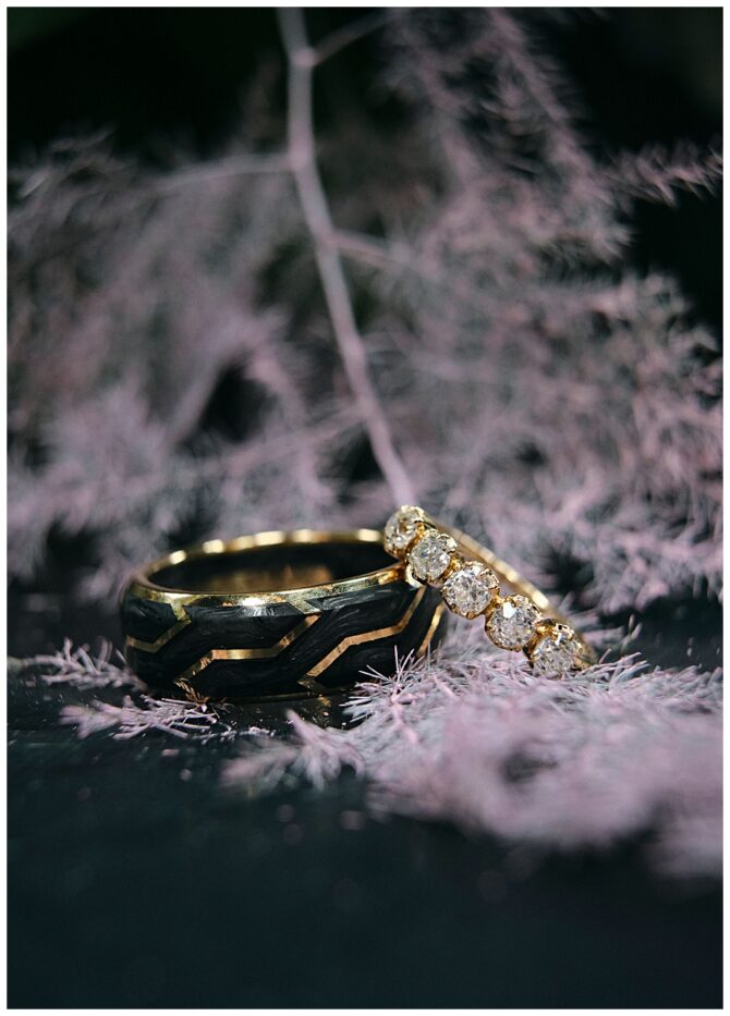 Gold rings on soft purple background.