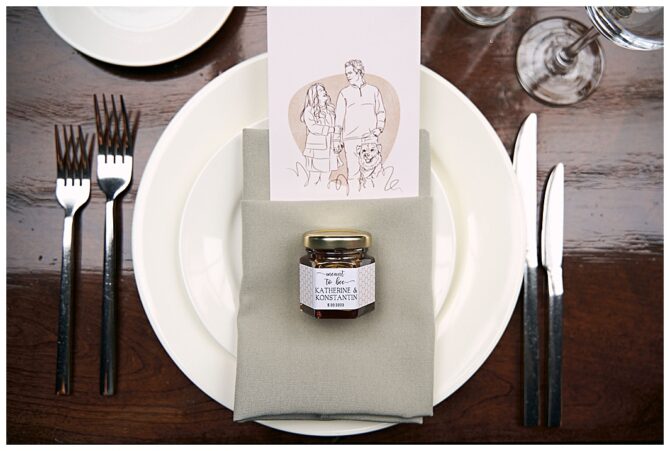Elegant place setting with personalized wedding favor.