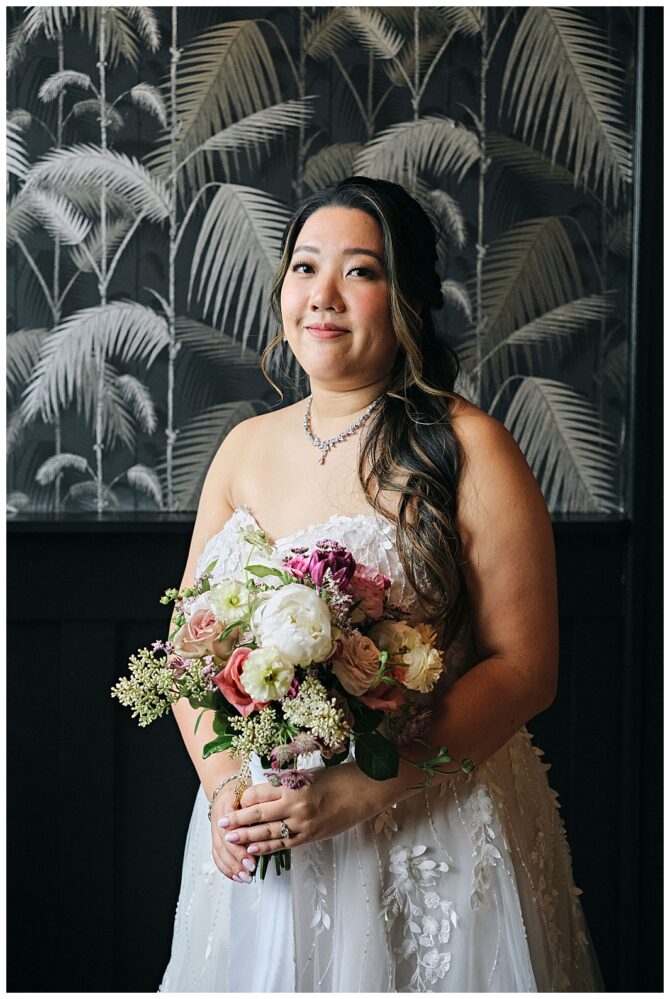 Bride with floral bouquet in elegant dress