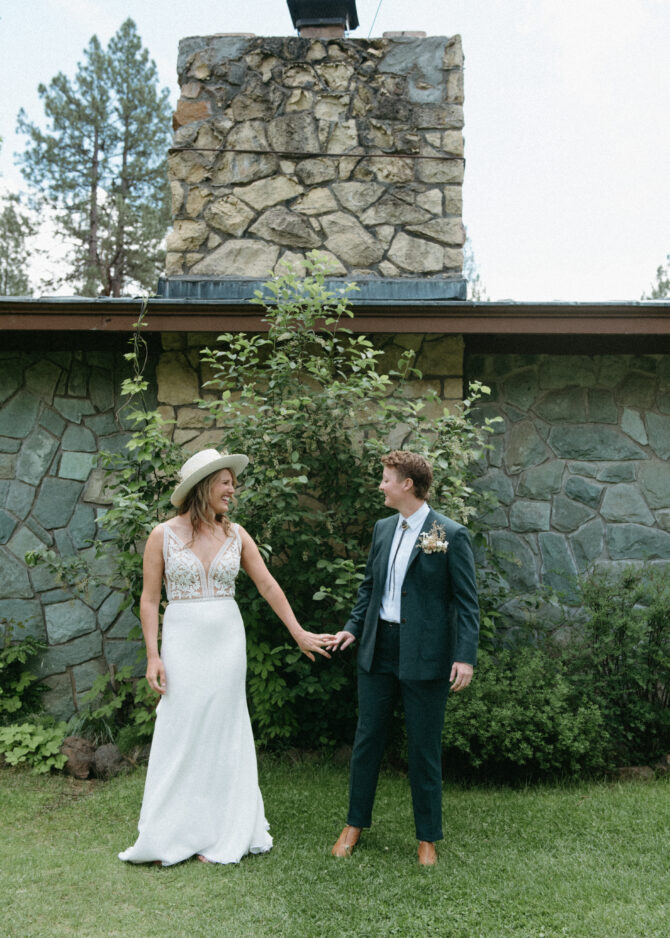 Couple holding hands outdoors.