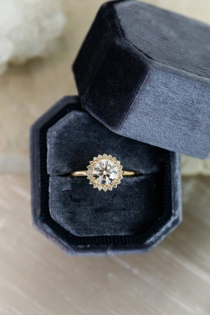 Gold ring with diamond in velvet box
