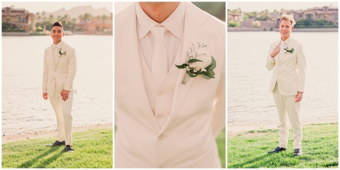 Groomsmen in white suits by a lakeside wedding venue.