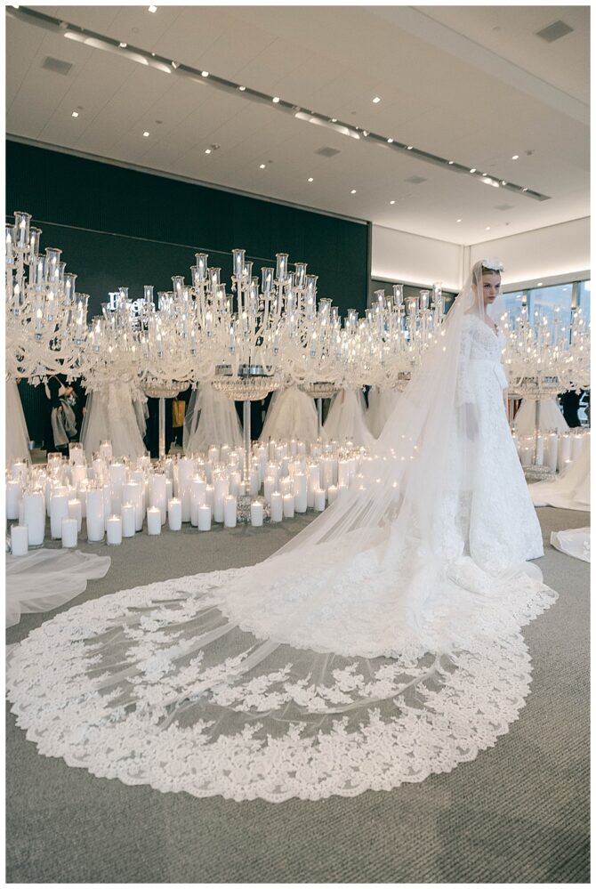 Elegant wedding dress with candles and chandeliers.