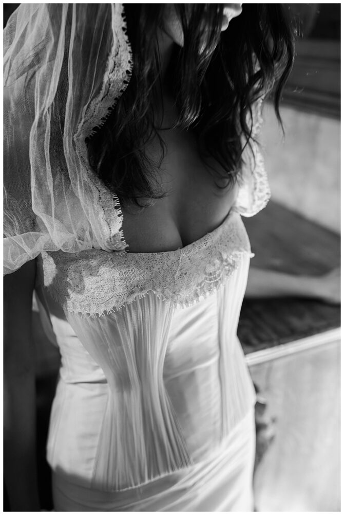 Bride in lace wedding dress and veil